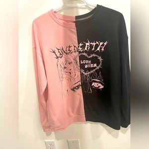 This sweater is a Anime Letter Figure Graphic Colorblock Sweatshirt from Romwe